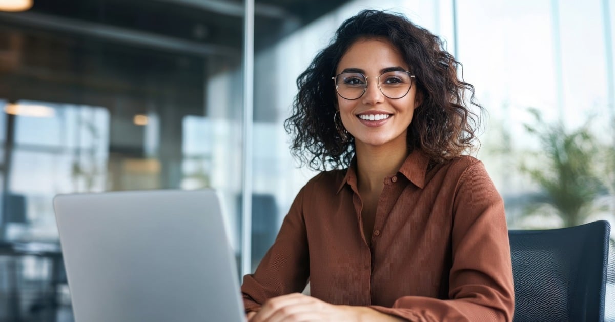 Woman in office reading TEAM methodology updates under the FY 2027 CMS proposed rule